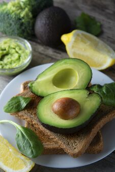 Delicious Wholewheat Toast With Guacamole, Avocado Slices. Mexican Cuisine. Healthy Food, Snack. Breakfast. Wooden Rustic Table Royalty Free Stock Image
