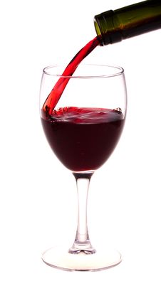 Red Wine Pouring From A Wine Bottle Stock Photo