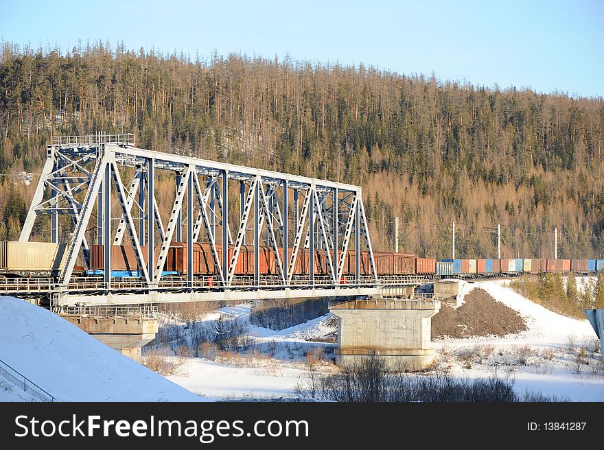 Cargo train going through the bridge. Cargo train going through the bridge