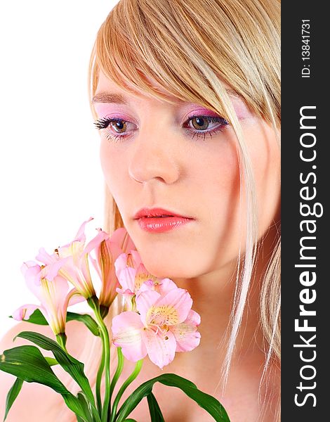 Portrait of a woman holding pink flowers over white background