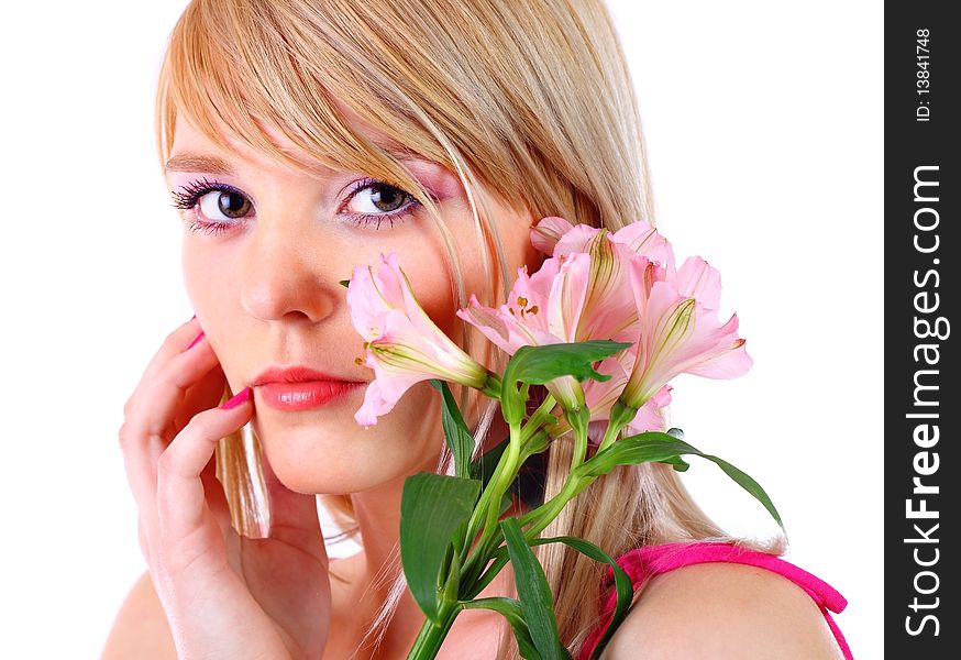 Portrait of a woman holding pink flowers over white background
