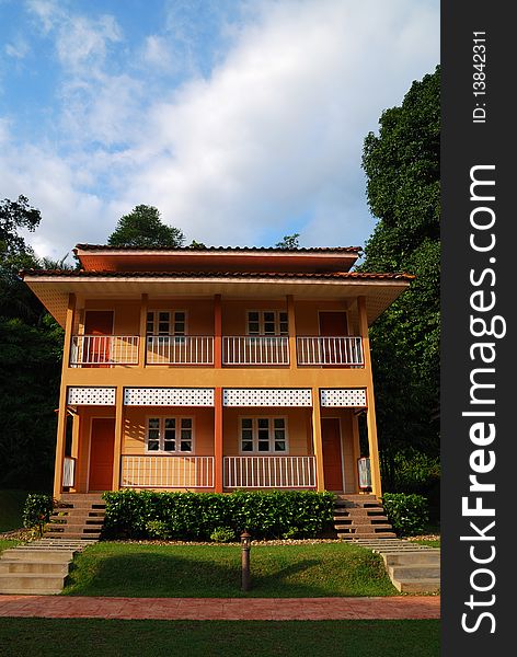 Photo of twin house with landscape and blue sky