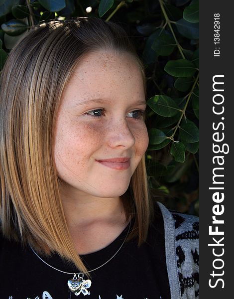 A beautiful white caucasian girl child with a happy expression on her face