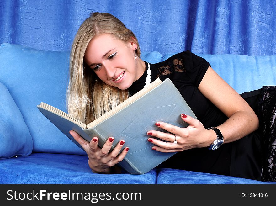 Woman read book at home in sofa