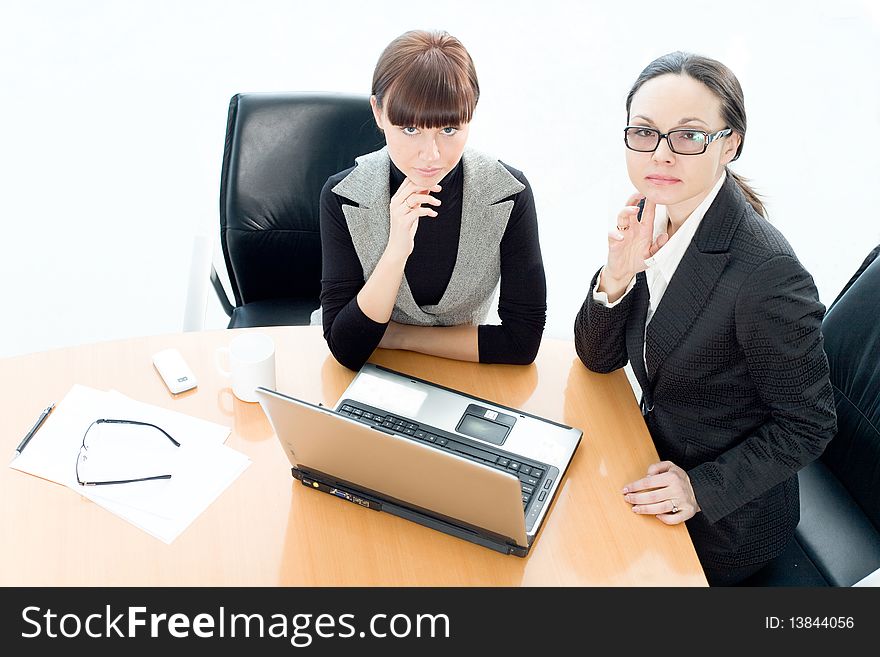 Girl and women in glasses at table