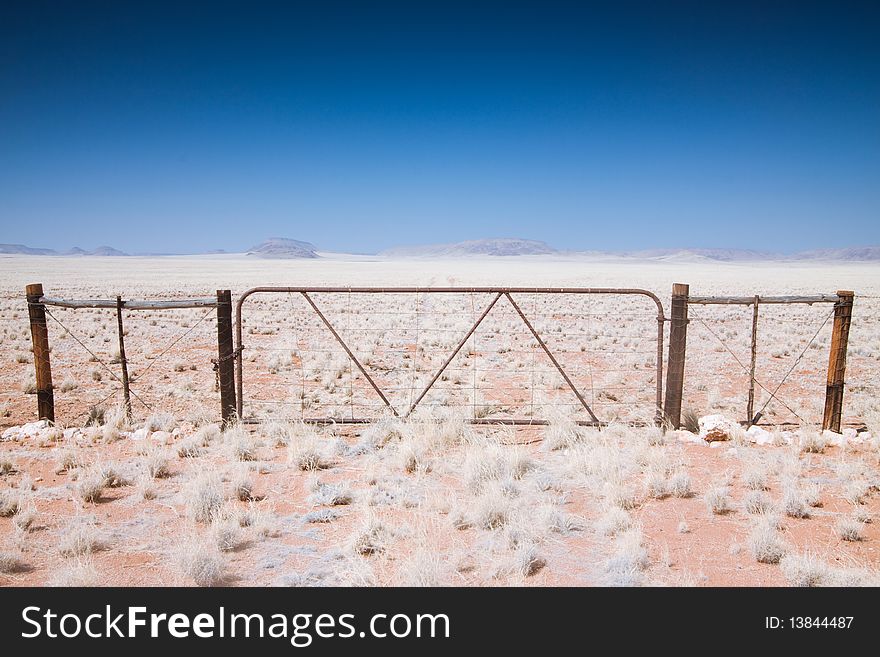 Photo of a gate in the Namibian Desert in Africa. Photo of a gate in the Namibian Desert in Africa