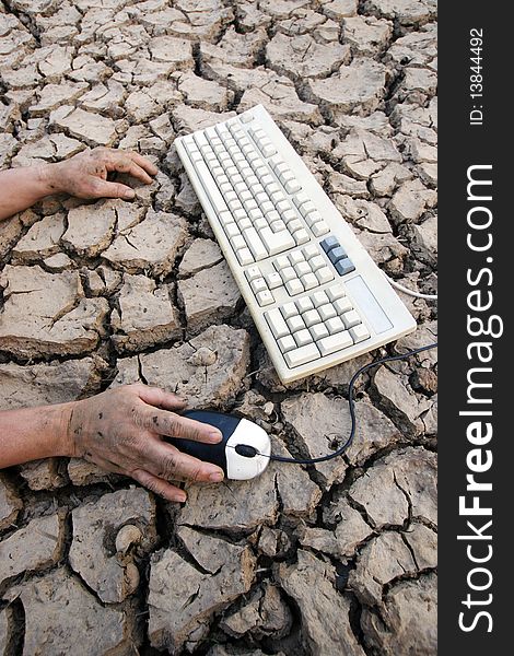 Hand keyboard on drought earth crack . Hand keyboard on drought earth crack