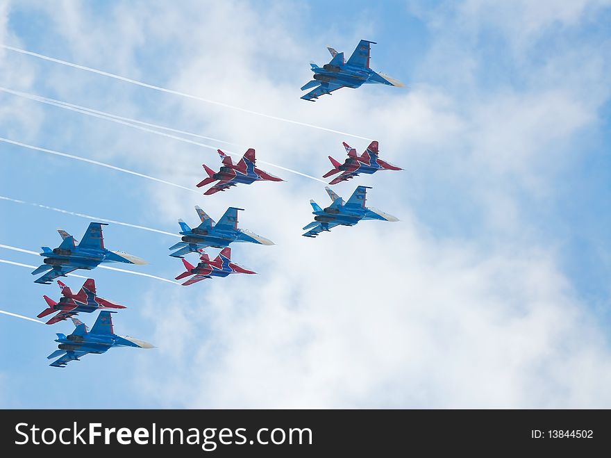 SU-27 and MIG-29 fighters performing aerobatics