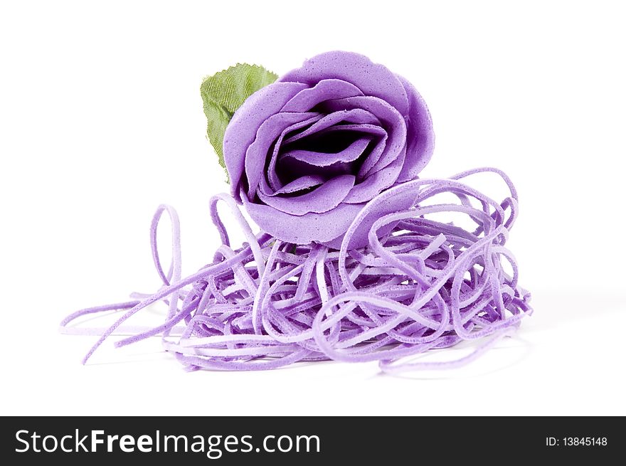Beautiful purple rose on a white background