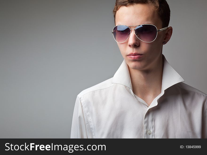 Portrait of young handsome man in sunglasses