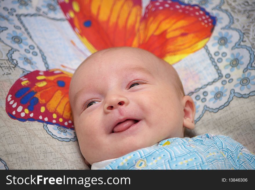 Photo of the baby with smile on face. Photo of the baby with smile on face