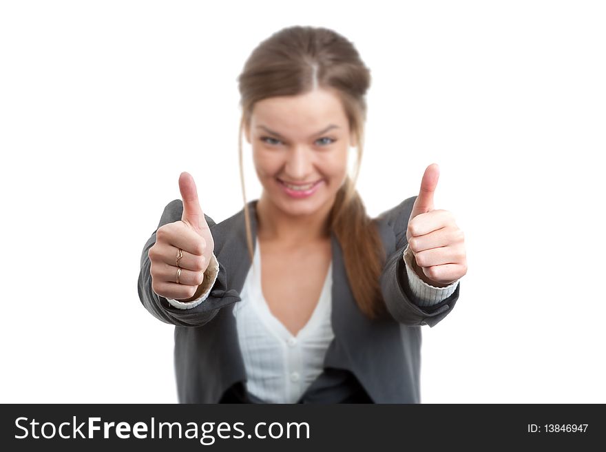 Portrait of a young businesswoman gesturing a thumbs up sign isolated over white. Portrait of a young businesswoman gesturing a thumbs up sign isolated over white