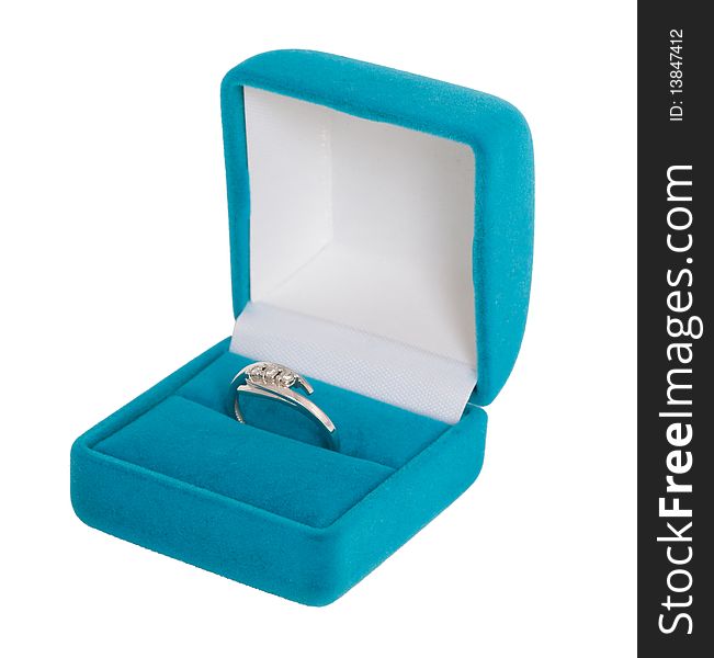 White gold ring with three diamonds in blue casket