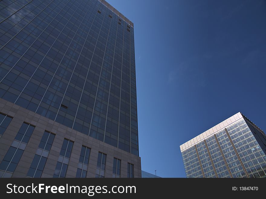 The modern office buildings on blue sky background