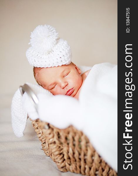 Adorable newborn baby in a hat