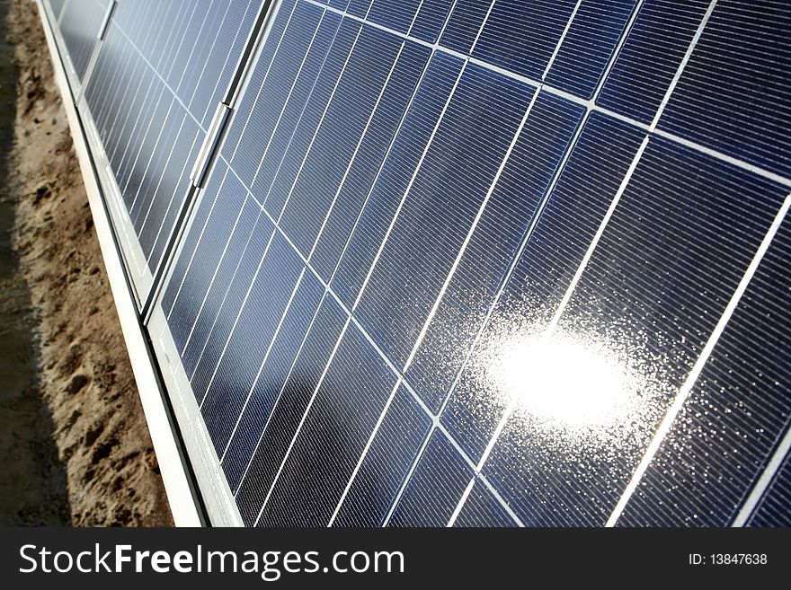 Modern solar photo voltaic panel close up with great blue cells details in a perspective view. Great for energy and environment themes.