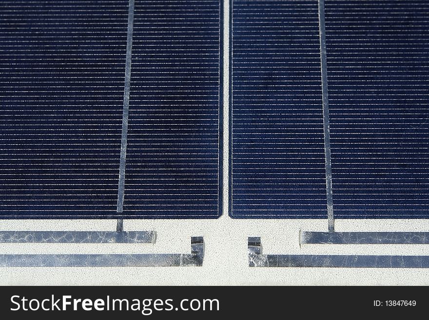 Modern solar photo voltaic panel close up with great blue cells details in a perspective view. Great for energy and environment themes.