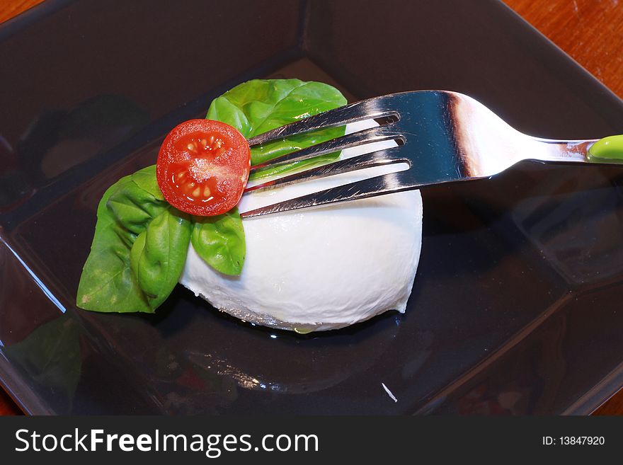 Mozzarella with tomatoes and basil