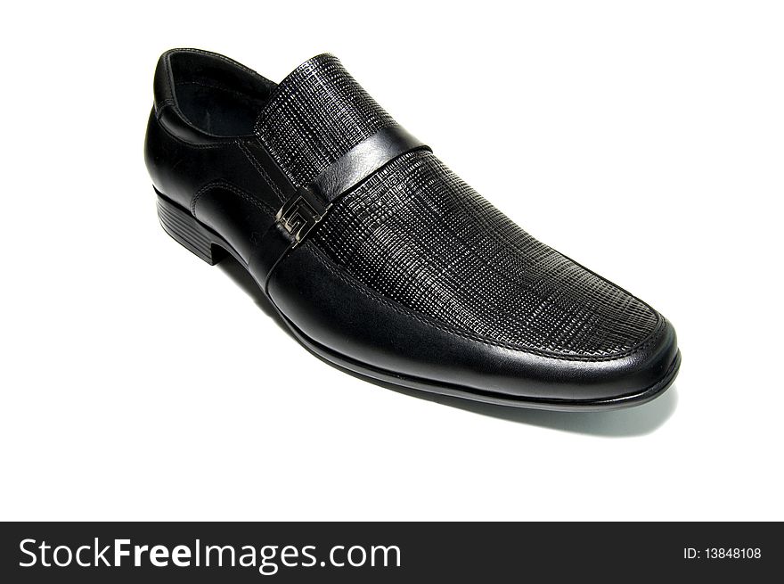 Black classical shoes over white background