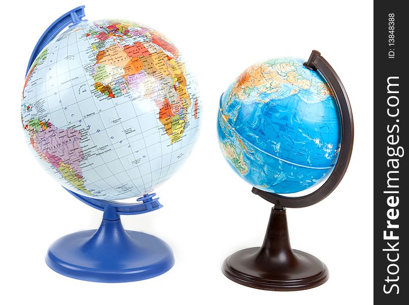 Two globes on blue and brown stand insulated on white background