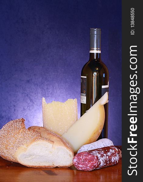 Composition of bread,   cheese and salami with bottle of wine. Composition of bread,   cheese and salami with bottle of wine
