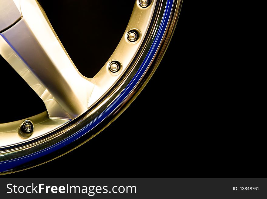 Metall gold wheel disc on a black background