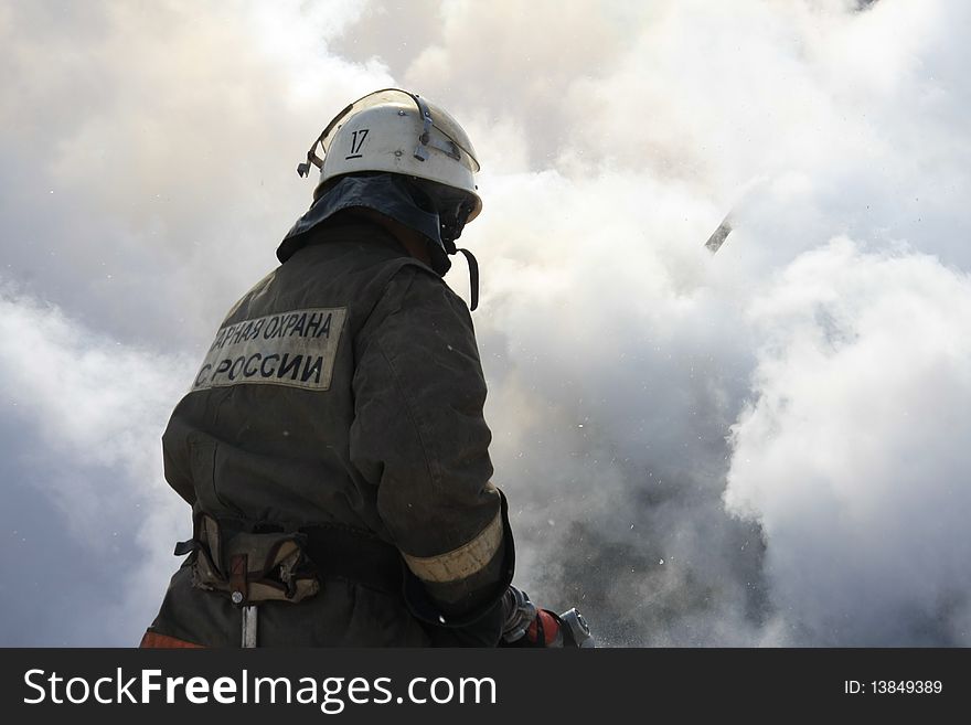 Firefighter extinguishes a forest fire. Firefighter extinguishes a forest fire