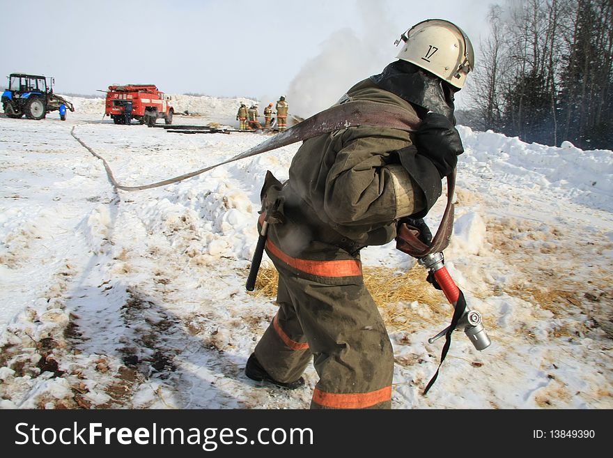 Firefighter extinguishes a forest fire. Firefighter extinguishes a forest fire