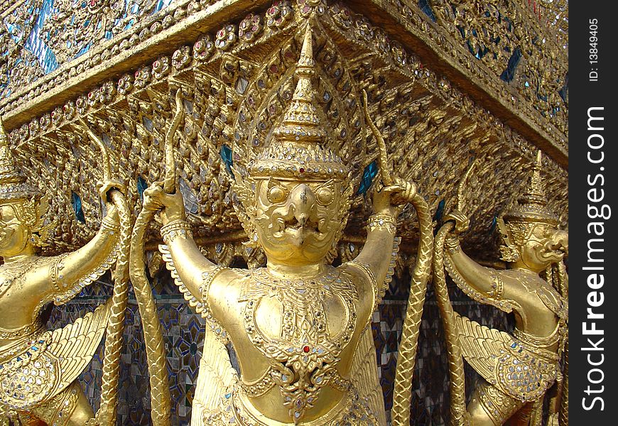 The garuda is aman-bird deity of Hindu-Buddhist myth or the supernatural half-man and half-bird vehicle or bearer of Vishnu. 
Refer to Wat Pra Keaw (Royal Temple) in Bangkok, Thailand