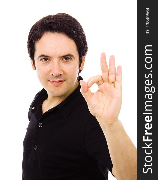Portrait of a smiling handsome young man gesturing ok sign, against white background. Portrait of a smiling handsome young man gesturing ok sign, against white background