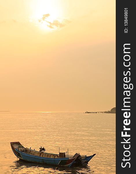 It is a sunset with alone boat in taiwan