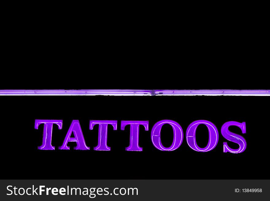 Neon sign TATTOOS for tattoos salon at the night