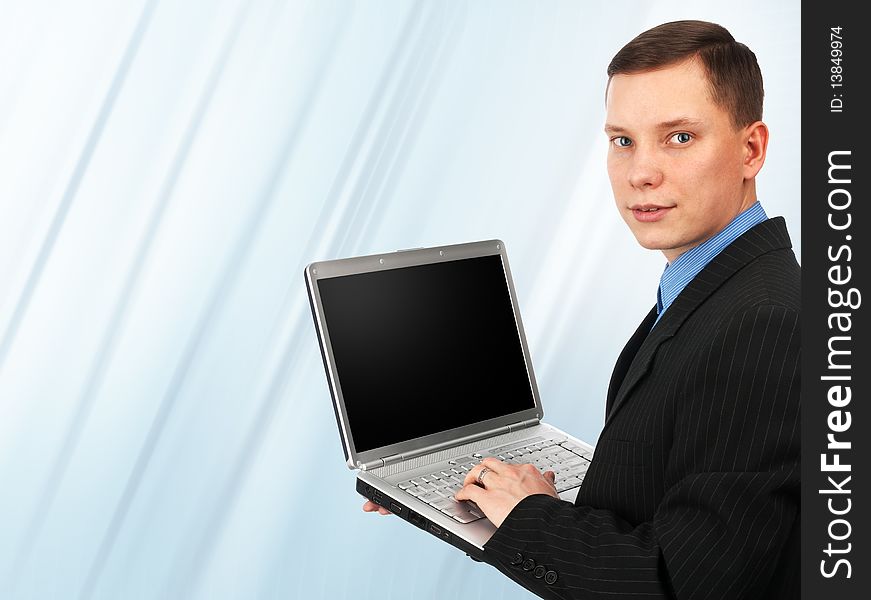 Young business man with his laptop. Young business man with his laptop