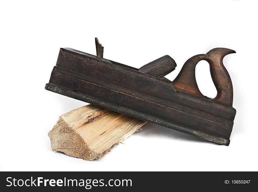 Carpenter's tool with a piece of wood on white background. Carpenter's tool with a piece of wood on white background