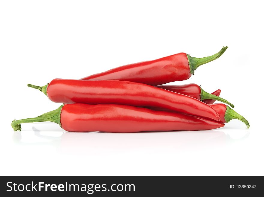 Red chilly peppers closeup on white background