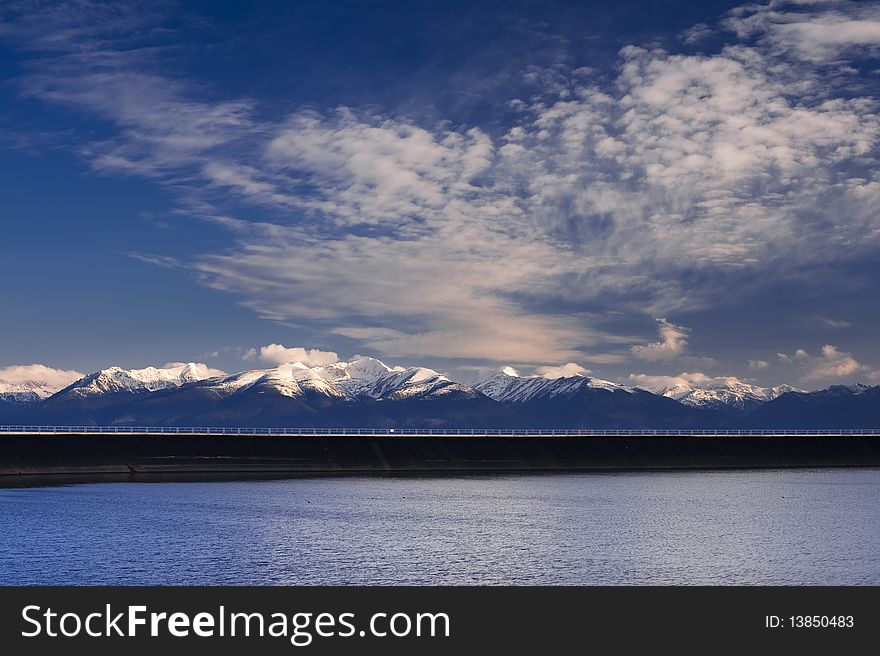 Dam Reservoir In Mountains