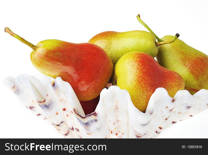 Ripe tasty red-yellow pears  in white vase. Ripe tasty red-yellow pears  in white vase
