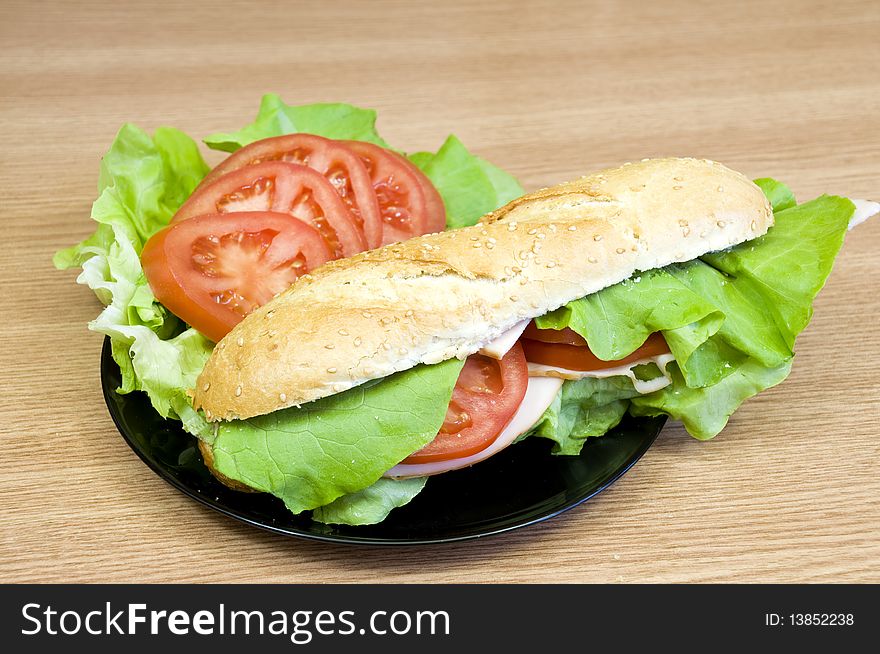 Delicious and fresh sesame baguette with turkey, cheese, lettuce and tomatoes. Delicious and fresh sesame baguette with turkey, cheese, lettuce and tomatoes