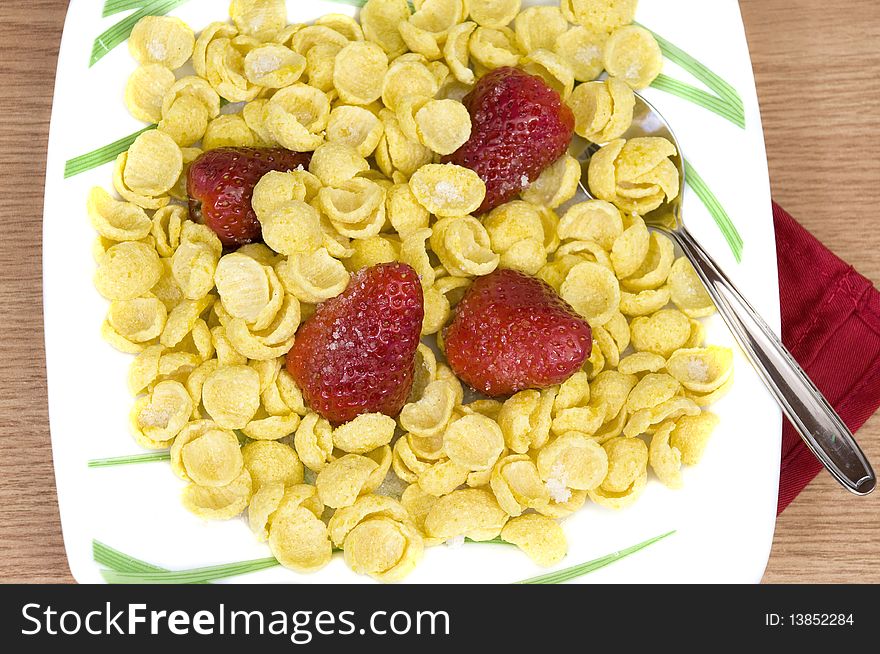 Crunchy tasty cereals with fresh organic strawberries