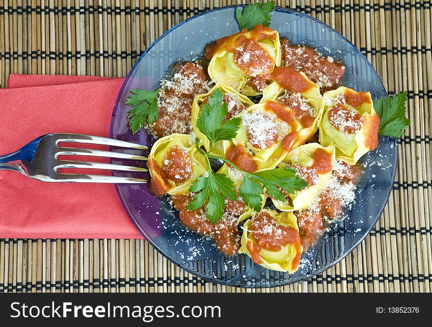 Yummy and indulgent lunch, tortellini with red sauce. Yummy and indulgent lunch, tortellini with red sauce