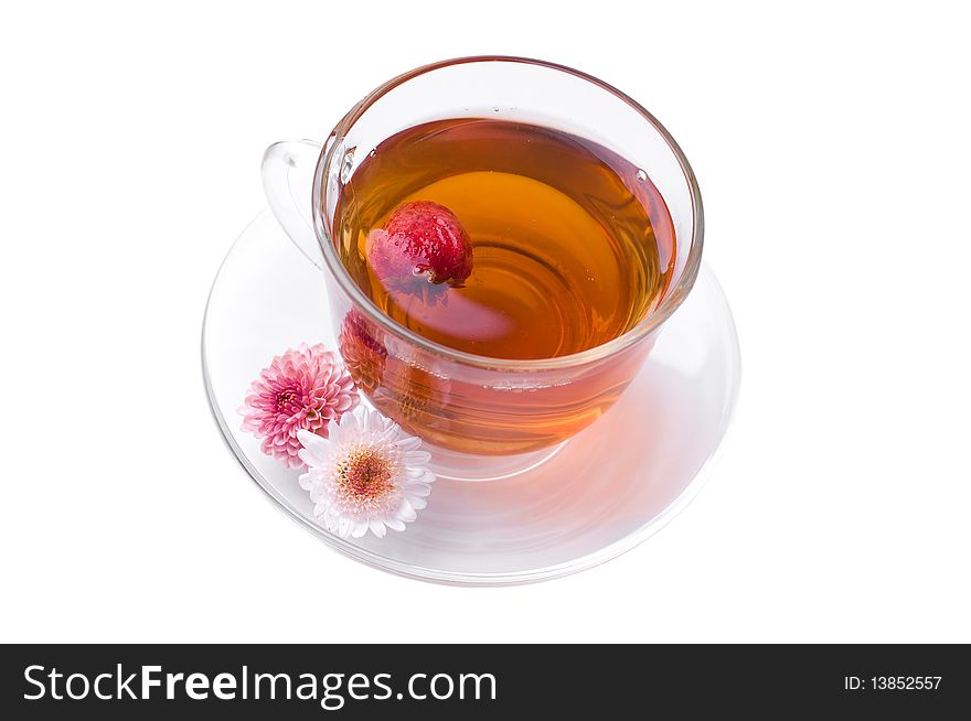 Cup of herbal tea with flowers isolated on white