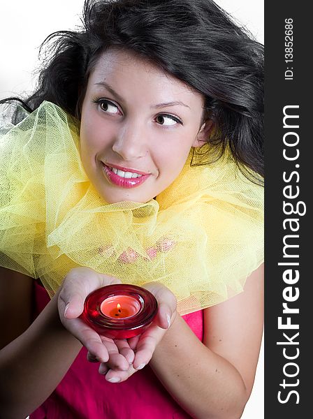 Beautiful happy girl with candles in hands