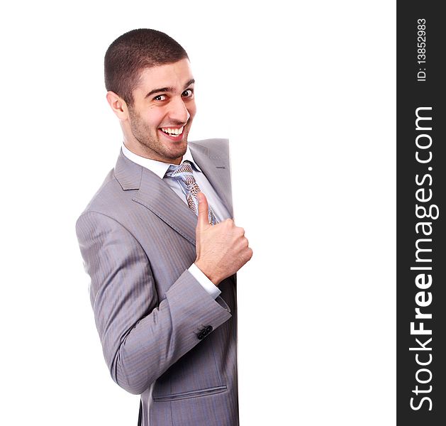 Young businessman in suit with white empty placard. Young businessman in suit with white empty placard