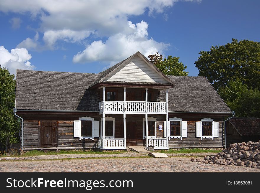 Old wooden country house, blue sky. Old wooden country house, blue sky