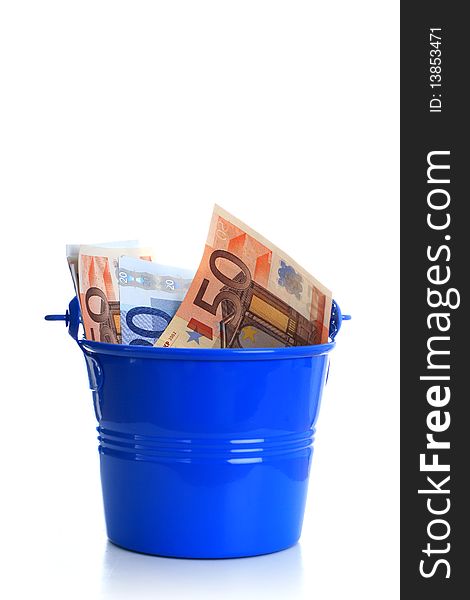 Euro money inside the bucket. Isolated over white.