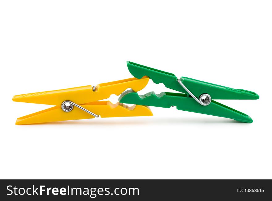 Photo of Colour clothespins on the white background. Photo of Colour clothespins on the white background