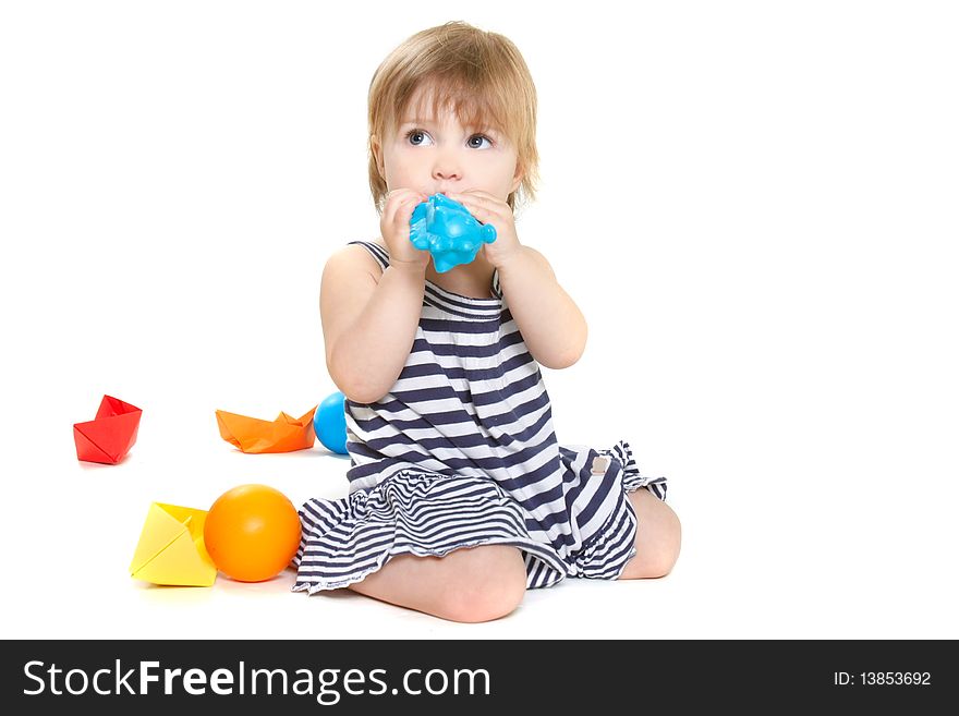 Cute toddler girl playing over white