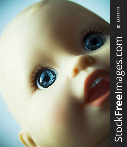 Closed frame shot of child's toy doll head. Closed frame shot of child's toy doll head