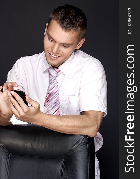 Young businessman with a mobile phone
