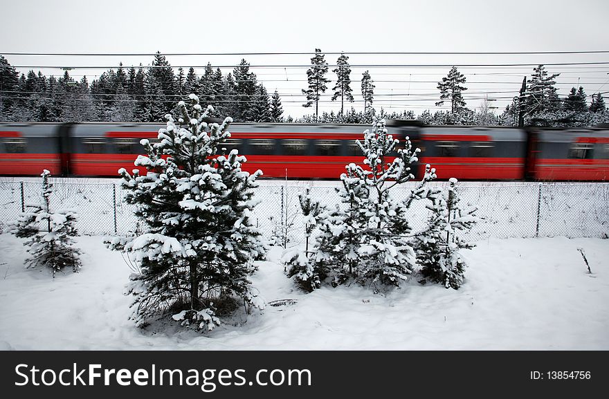 Red train speeding through winter landscape. Red train speeding through winter landscape